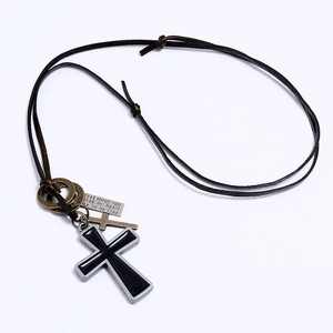 Vintage cross necklace with black enamel pendant and engraved tag on leather cord