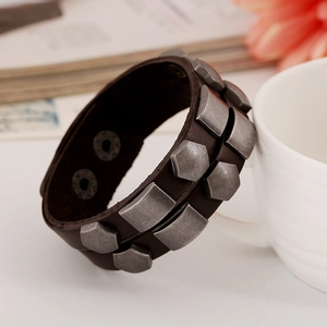 Men's vintage punk leather bracelet with silver rivets and dual snap closure