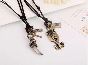 Detail of retro leather necklaces featuring punk dragon claw and F1 racing car pendants