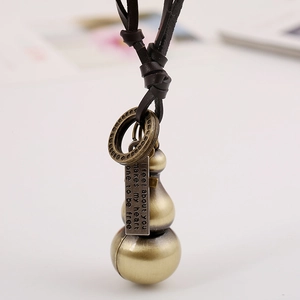 Vintage bronze gourd pendant with leather rope and engraved metal quote plaque
