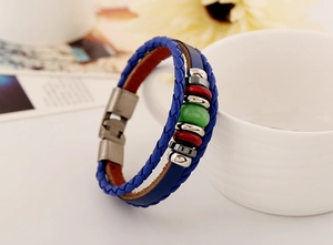 Detail view of multilayer blue leather braided bracelet with beads and metal clasp