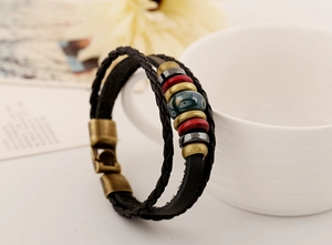 Close-up of bohemian multilayer leather bracelet with colorful beads and magnetic clasp