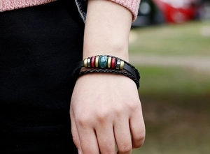 Bohemian multilayer leather bracelet with red wooden beads and turquoise center stone