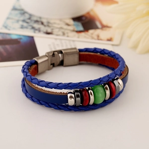 Retro punk blue leather bracelet with layered weave and green cat eye bead decoration