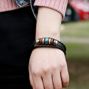 Multilayer leather beaded bracelet featuring a bohemian style and vintage metal accents