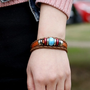 Multilayer punk leather bracelet with blue ceramic bead and brown braided cords