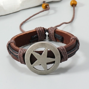 Detail of vintage braided leather bracelet with star pendant and wooden bead accents