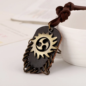 Vintage rock style necklace with layered brown leather pendant and sun gear metal badge