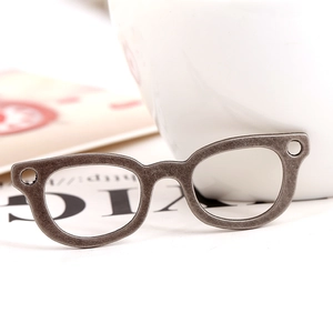 Vintage silver alloy eyewear pendant for DIY jewelry making on white aesthetic background