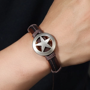 Retro handmade braided leather bracelet with a vintage silver star charm for men