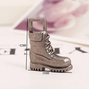 Detail view of vintage silver boot charm with 42mm and 38mm dimensions for DIY jewelry