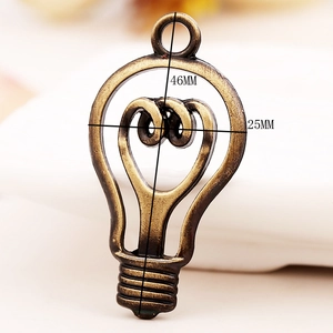 Detail of vintage bronze light bulb alloy pendant with 46mm height and 25mm width dimensions