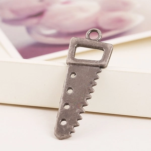 Vintage silver saw-shaped alloy pendant charm with hollow holes and top hanging ring