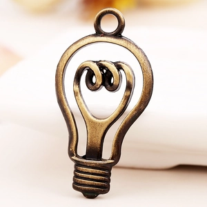 Vintage bronze alloy light bulb pendant with spiral filament for DIY jewelry making