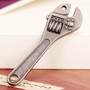 Antique silver adjustable wrench pendant with skull detail for DIY gothic jewelry
