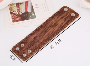 Macro detail of wide punk brown leather bracelet showing 23.7cm length and 6cm width