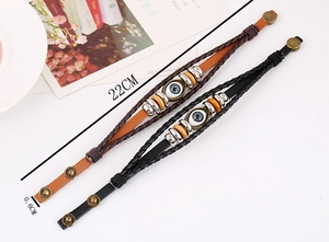 Detail showing braided leather bracelets with evil eye bead and dimensions 22cm x 0.6cm