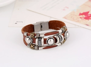 Detail shot of multi-layer brown leather bracelet with silver and bronze vintage beads