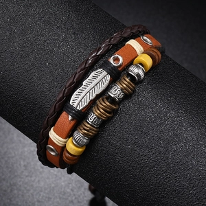Multilayer leather beaded bracelet with silver feather charm and vintage wood beads