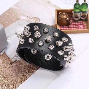 Black leather punk bracelet featuring three rows of silver metal cone studs and studs