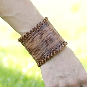 Vintage wide brown leather punk bracelet with rugged wood-grain texture and thick stitching