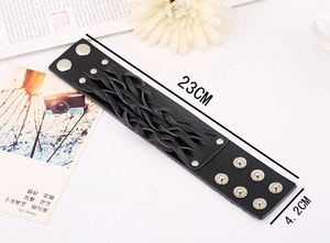 Close-up of wide black braided leather punk bracelet with dimensions 23cm by 4.2cm