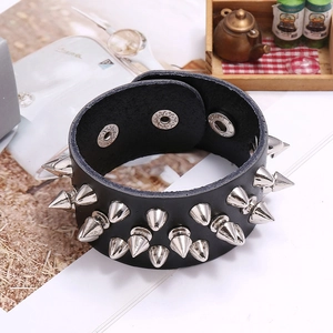 Punk wide leather bracelet with silver metal spikes and adjustable triple snap closure