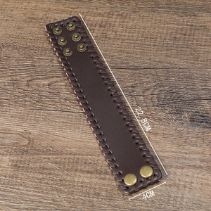 Detail of retro braided leather bracelet with six copper snaps measuring 22.8cm by 4cm