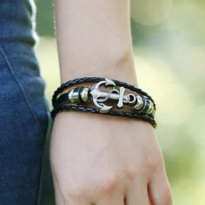 Multi-layer woven leather anchor bracelet for men featuring a vintage silver pendant