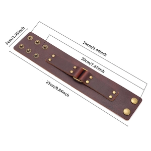 Adjustable brown leather punk bracelet with bronze studs and metal ring on white background