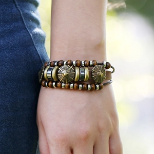 Vintage multilayer leather bracelet with wooden beads and a star engraved metal charm