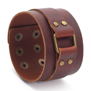 Adjustable vintage brown leather bracelet with bronze buckle and punk style metal studs