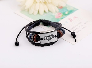 Detail of multi-layer leather bracelet with metal LOVE charm and wooden beads