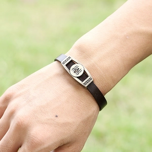 Men's vintage brown leather bracelet featuring a metal spider motif and Greek key design