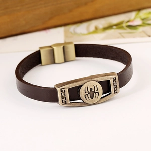 Vintage brown leather bracelet with bronze spider emblem and Greek fret details