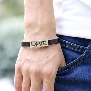 Vintage brown leather bracelet for couples featuring a LOVE engraved metal plate