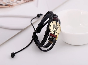 Macro shot of multilayer leather Aquarius constellation bracelet with wooden beads