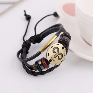 Pulsera de cuero trenzado con signo Aries en bronce antiguo y cierre de cuerda ajustable