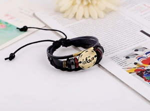 Detailed macro of a vintage Virgo leather bracelet with antique bronze charm and beads
