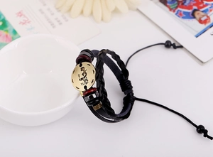 Detailed view of Virgo leather braided bracelet with antique bronze zodiac charm and beads