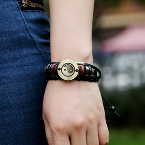 Retro multi-layer leather bracelet featuring bronze Yin Yang charm and beaded accents