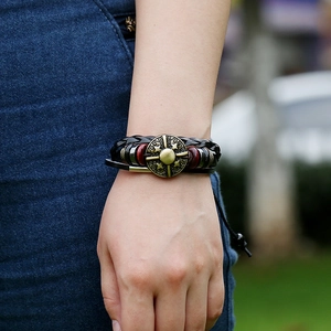 Vintage multi-layer braided leather bracelet with bronze compass charm and wooden beads