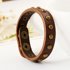 Vintage dark brown leather punk bracelet with bronze metal studs and adjustable snap buttons