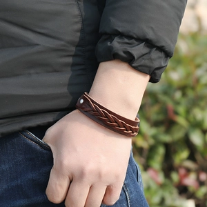 Men's multilayer woven brown leather bracelet with silver metal rivet on model