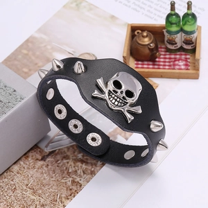 Punk black leather wristband with silver metal skull charm and sharp cone studs
