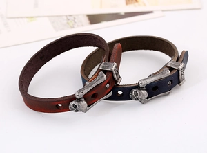 Detail of vintage punk leather bracelets with silver skull buckles and adjustable metal studs