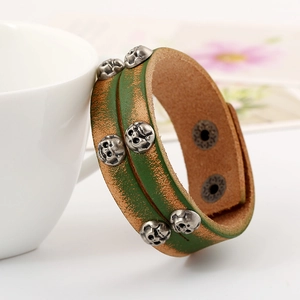 Retro punk genuine leather bracelet with silver skull charms and snap button closure
