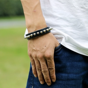 Punk black leather wristband with silver metal spikes for rock and street style