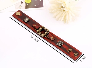 Détails du bracelet punk en cuir avec emblèmes métalliques et dimensions de la taille