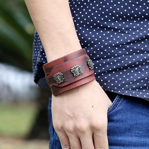 Retro punk genuine leather wide bracelet in burgundy with vintage metal shield ornaments